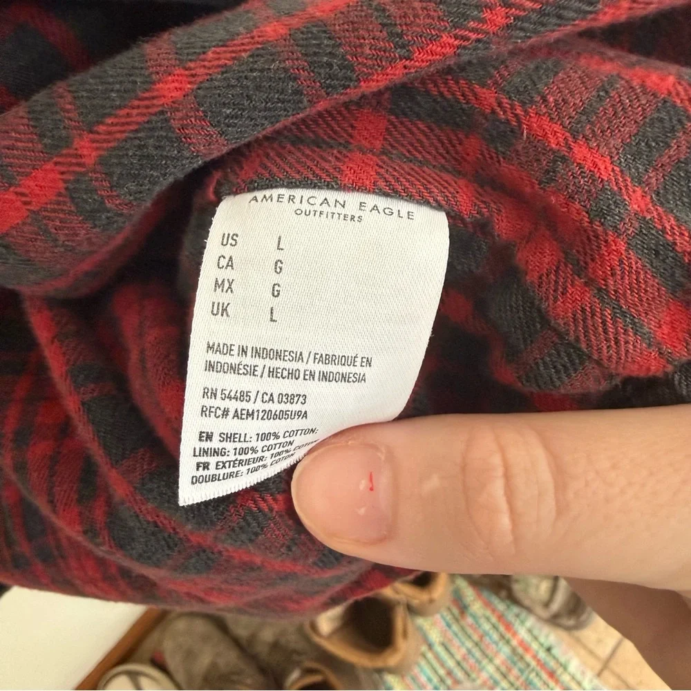 American Eagle Outfitters Distressed Black Jacket with Red Plaid Interior